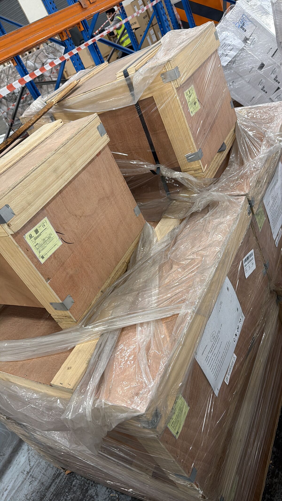 Regulated crated cargo wrapped and labelled in the Spider Lines warehouse awaiting clearance